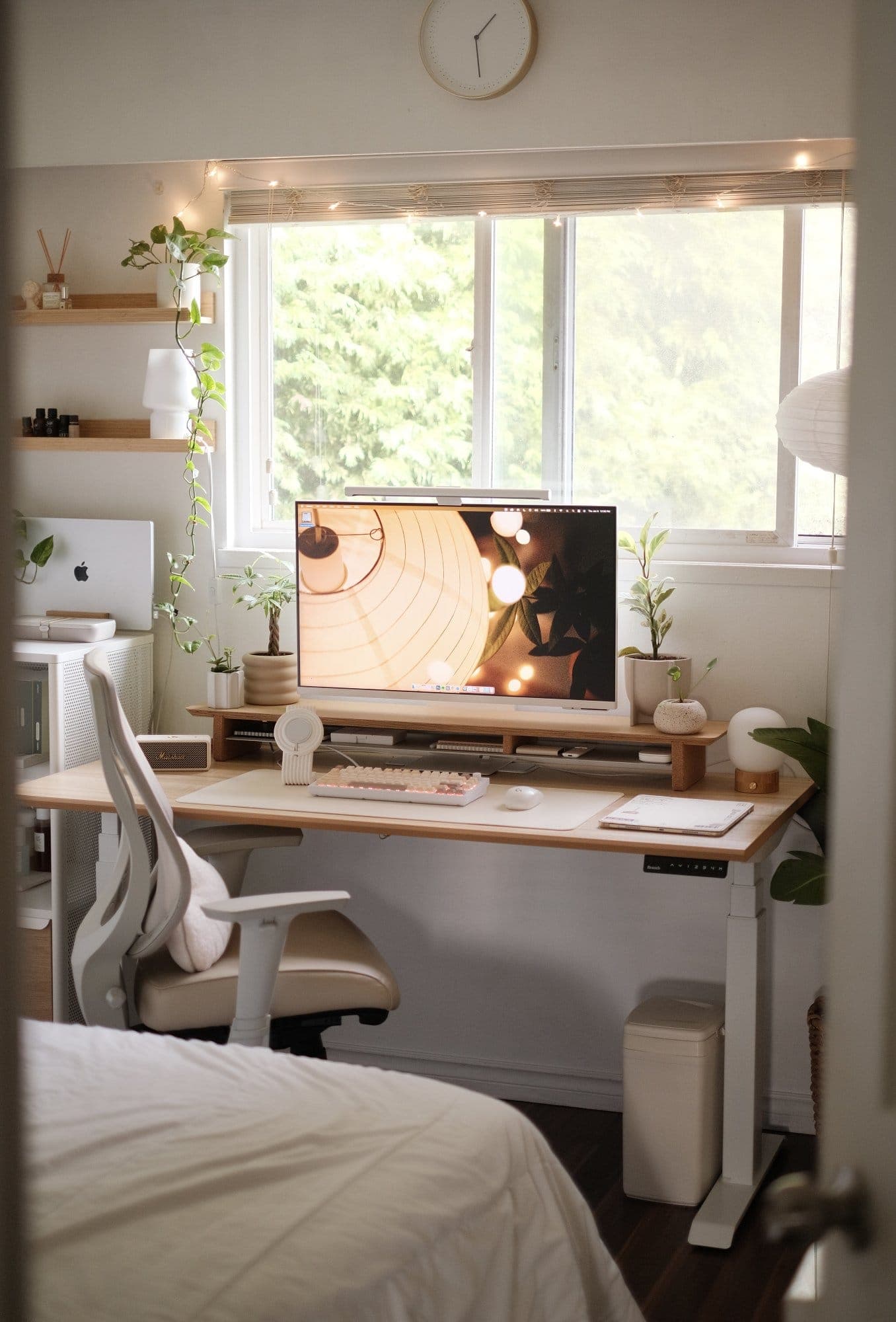 Cosy Bedroom Desk Setup with Plants in Canada